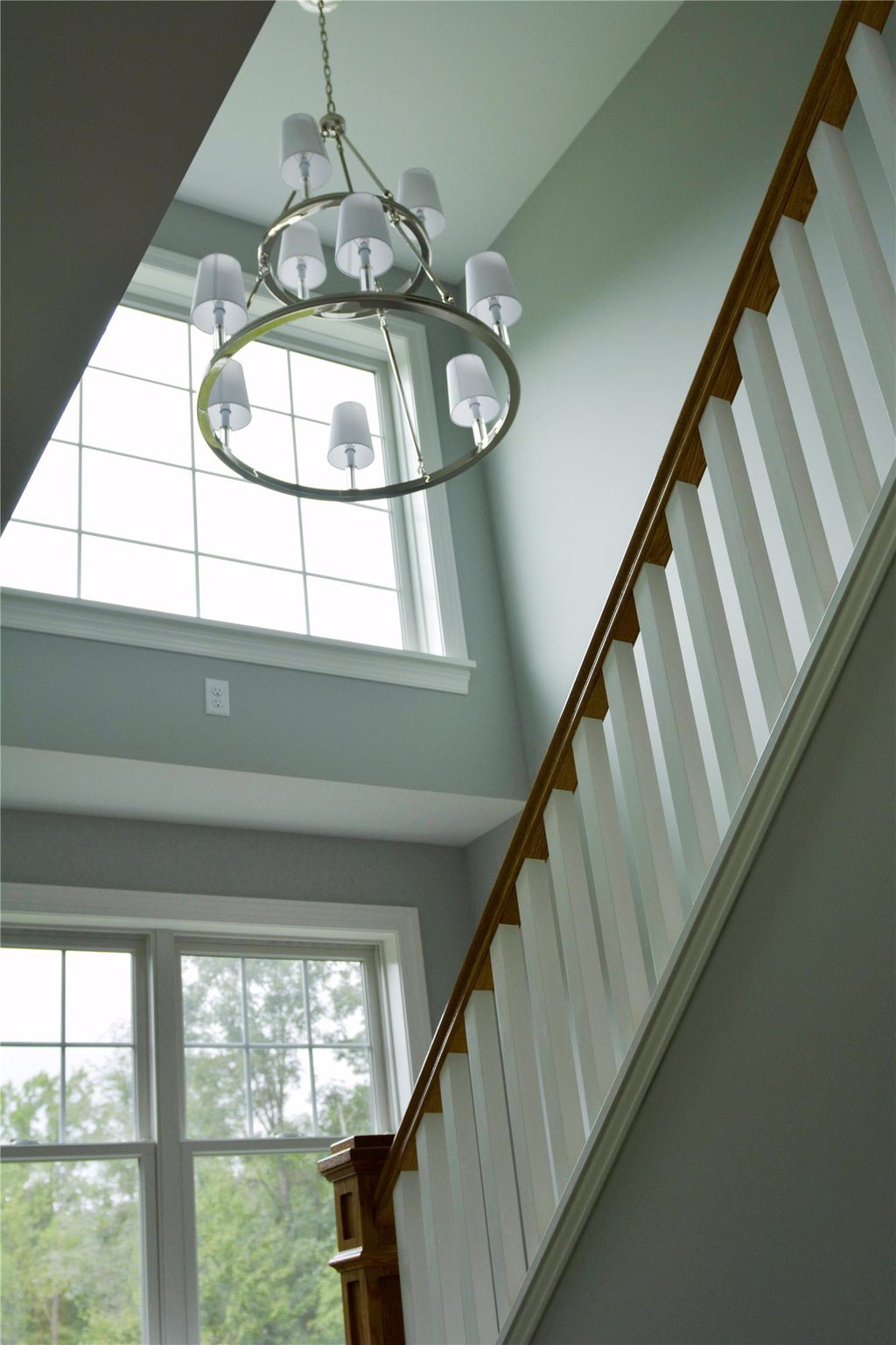 Vaulted Ceiling Staircase with Modern Chandeler