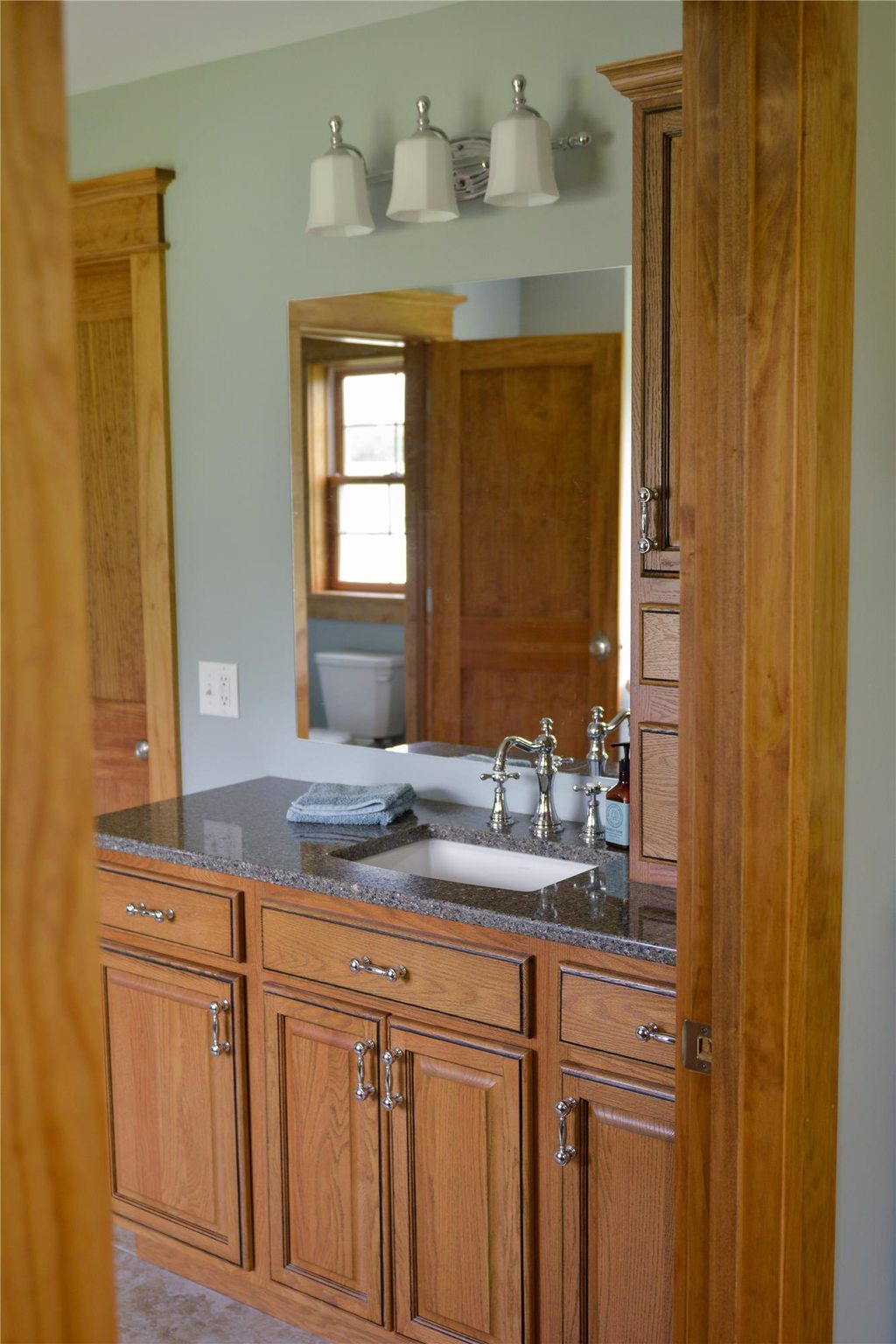 Bathroom Remodeled Bathroom with Flat Mirror and Overhead Lighting