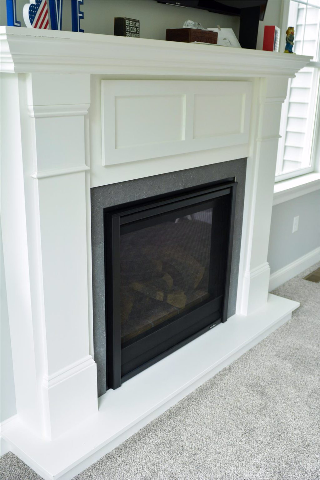 Fireplace and Mantel Fireplace and Mantel over Carpet with Molding